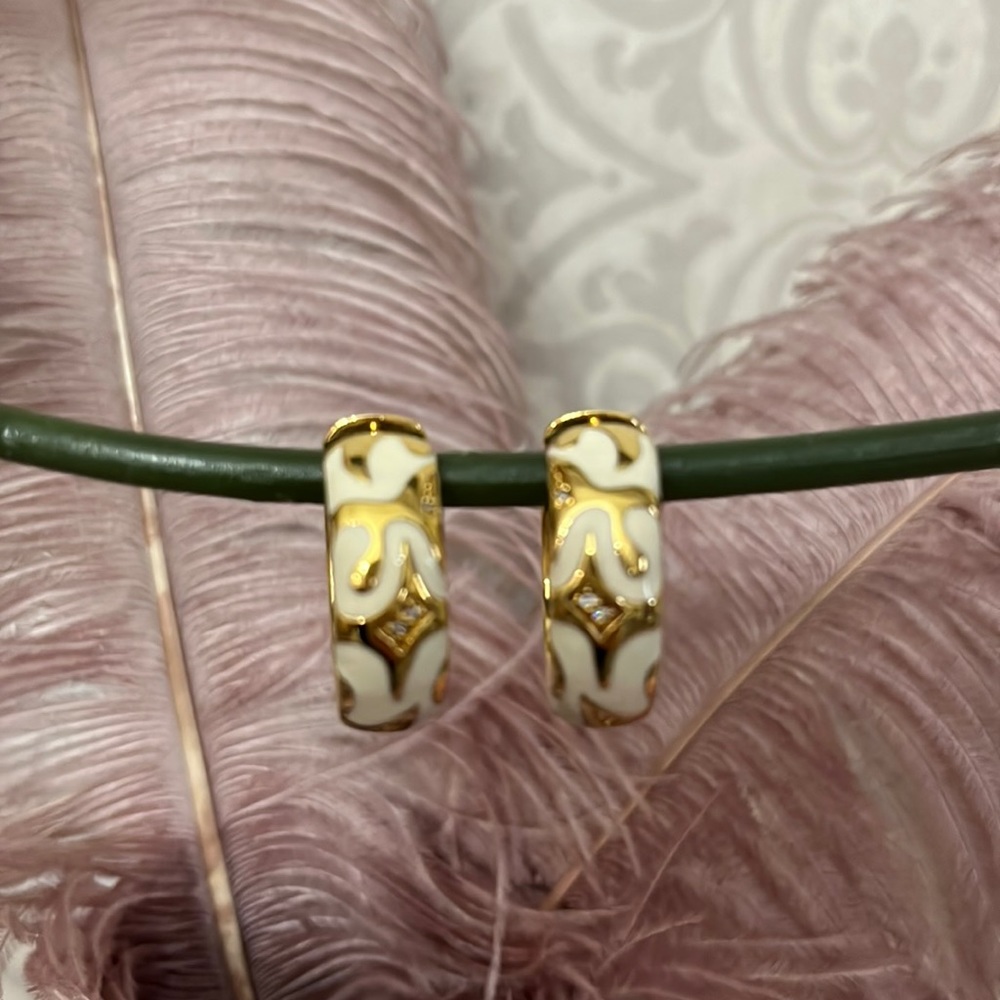 Lauren G Adams gold and white enamel earrings with clear stones.